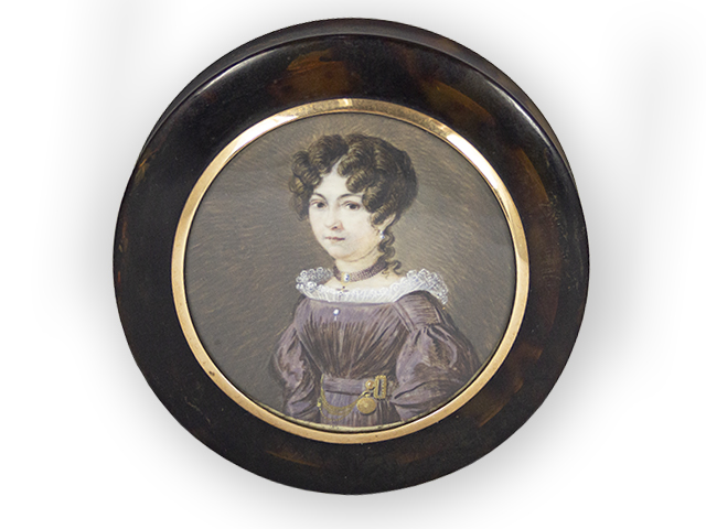 Tortoiseshell snuffbox with a portrait miniature of a young lady.